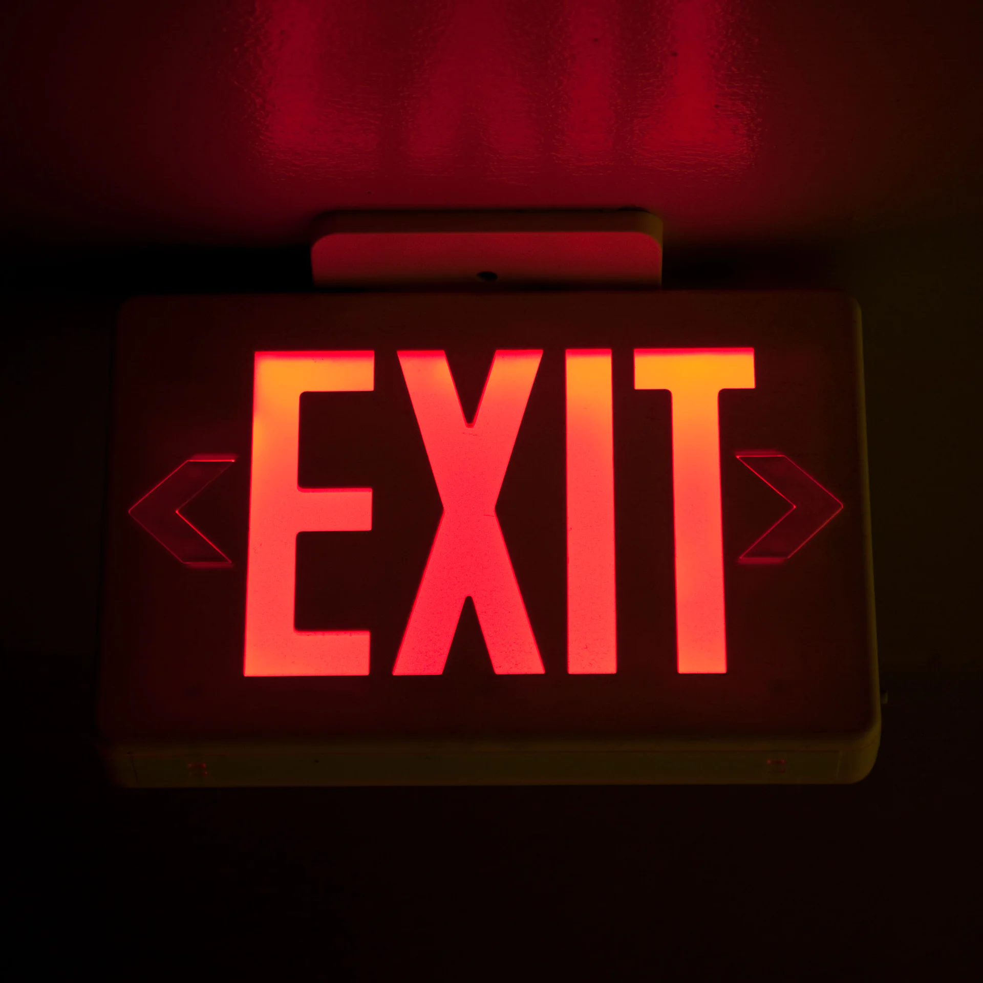 Emergency exit light in smoky hallway